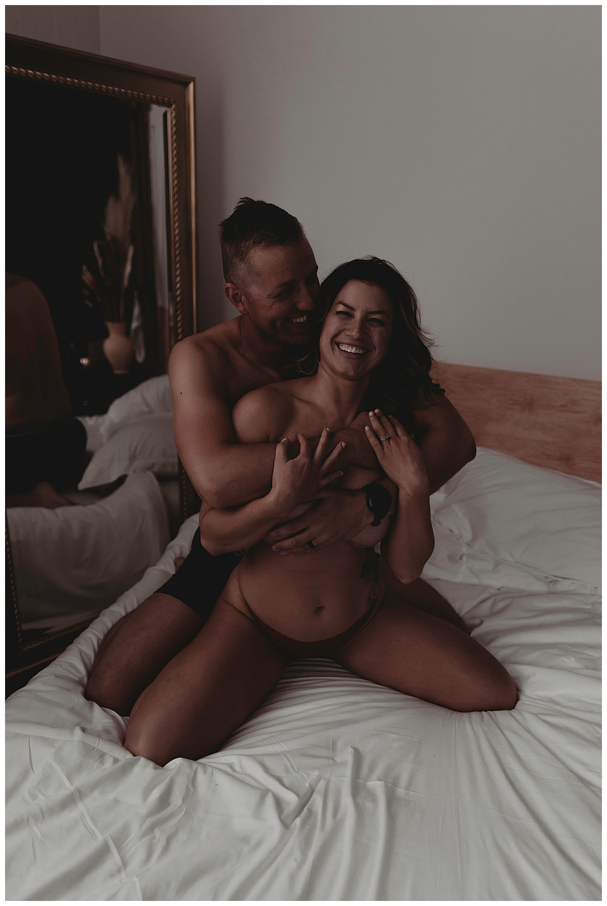 Couple smiles and holds one another for Spicy Couples Session