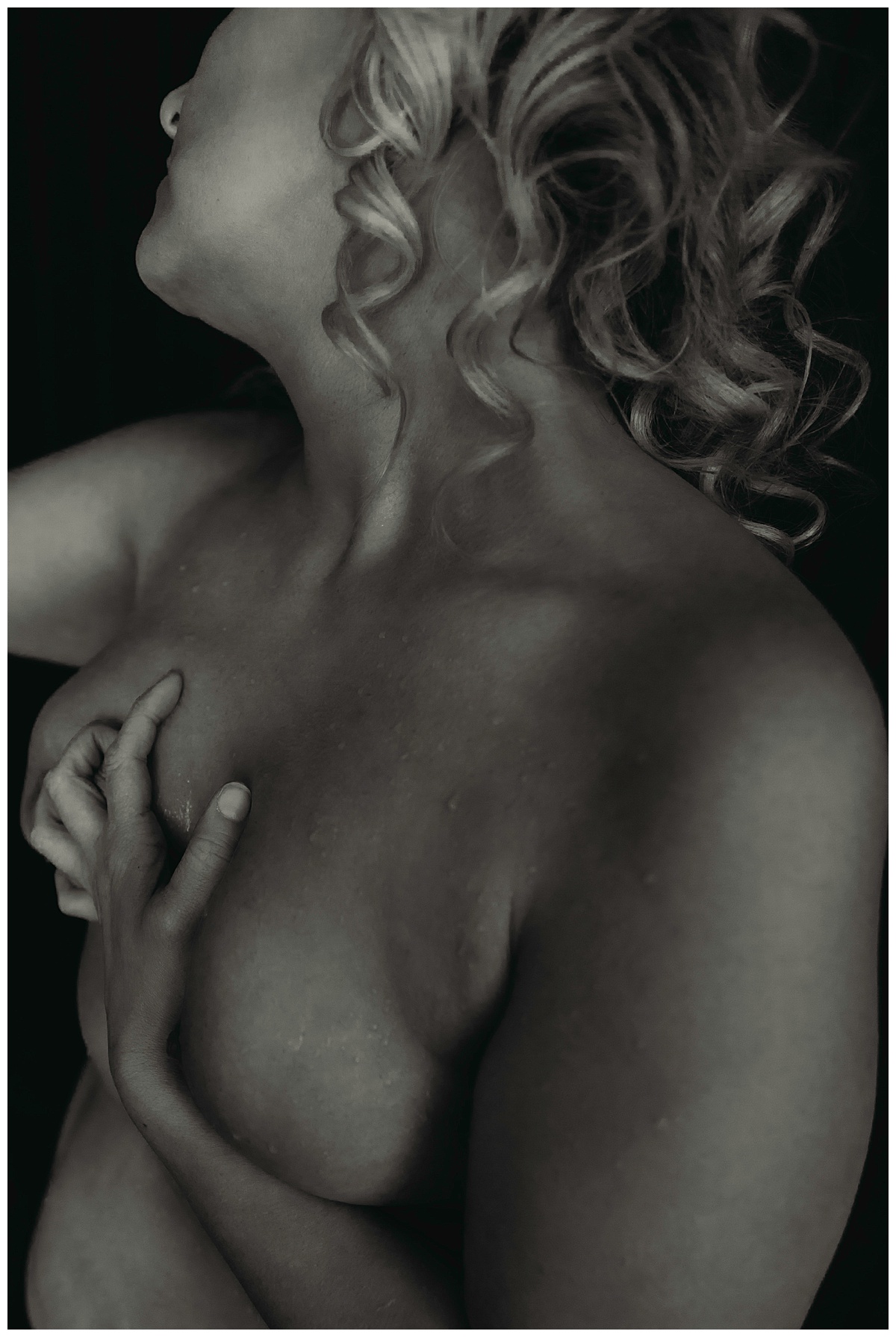 Curls on blonde woman by Boudoir Photography Minnesota