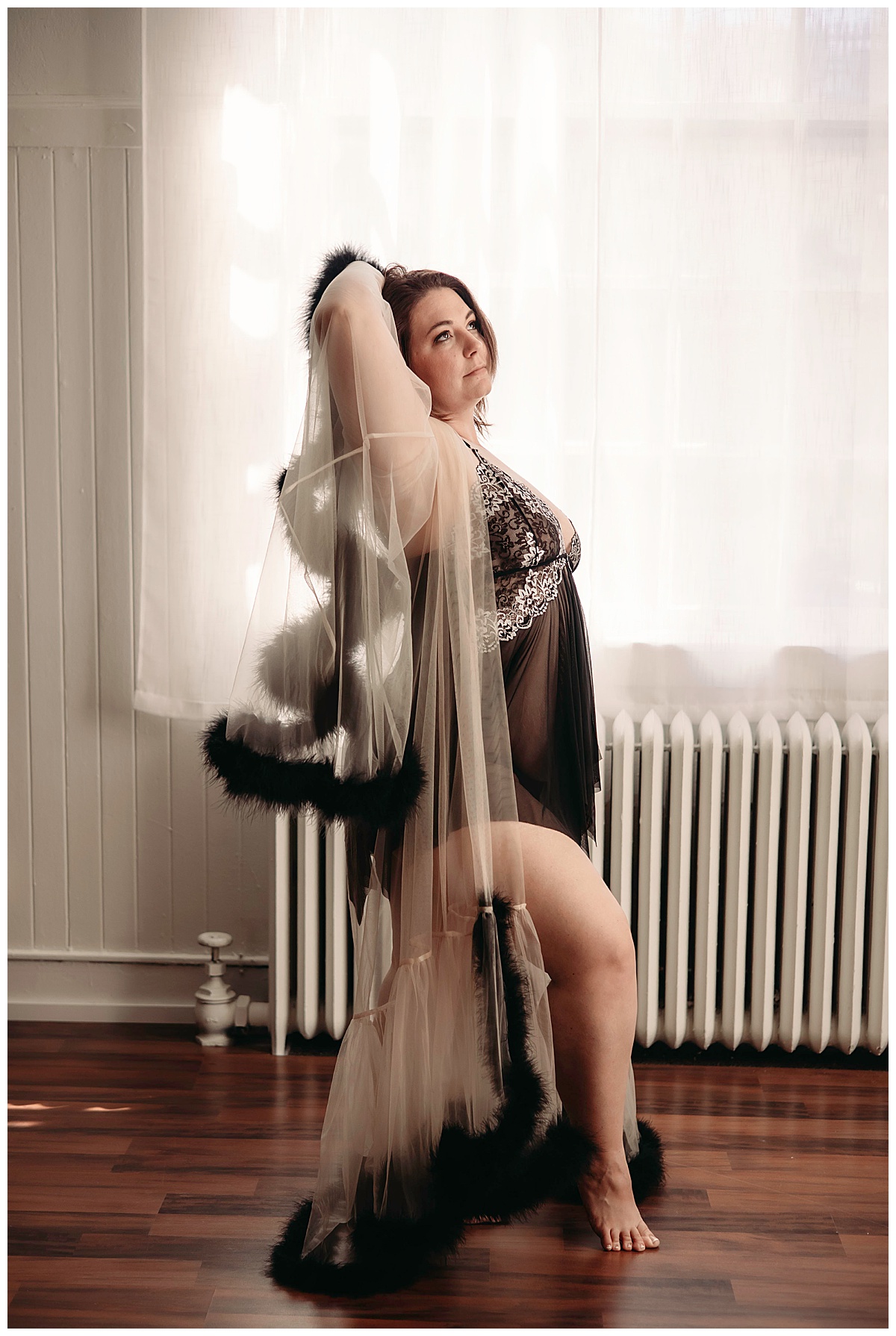 Adult in black boa robe for Reclaiming Your Body session