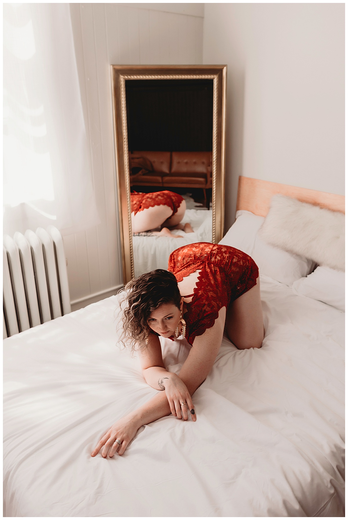 Woman leans over bed for Minneapolis Boudoir Photographer