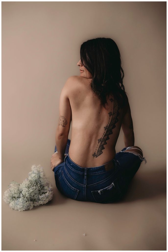 Tattooed woman turns around to Make Your Session Yours